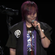 Pictured is Ogata on stage, singing.